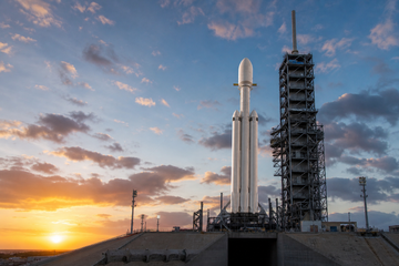 SpaceX Falcon Heavy rocket with NASA Roman Space Telescope payload on pad at dawn