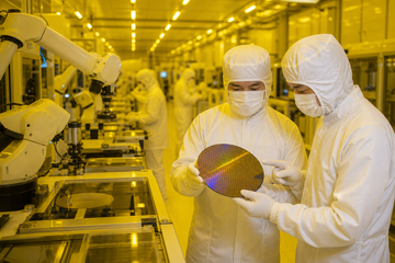 Samsung semiconductor fab interior with robotic wafer handling equipment and technicians in cleanroom suits