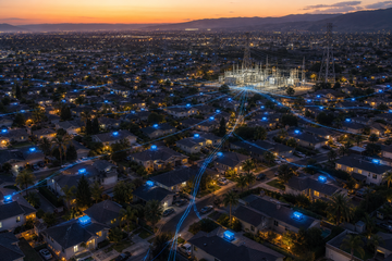 Aerial view of California homes with Powerwall batteries discharging to the grid at dusk