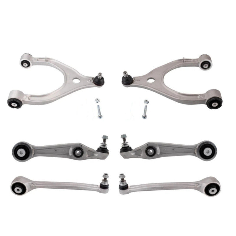 Set of automotive control arms and links on a white background