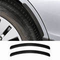 Pair of black wheel arch protector strips shown beside a strip fitted above a car tire