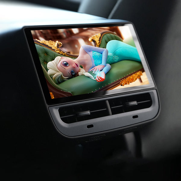 Rear entertainment screen fitted above two center-console air vents and showing an animated film.